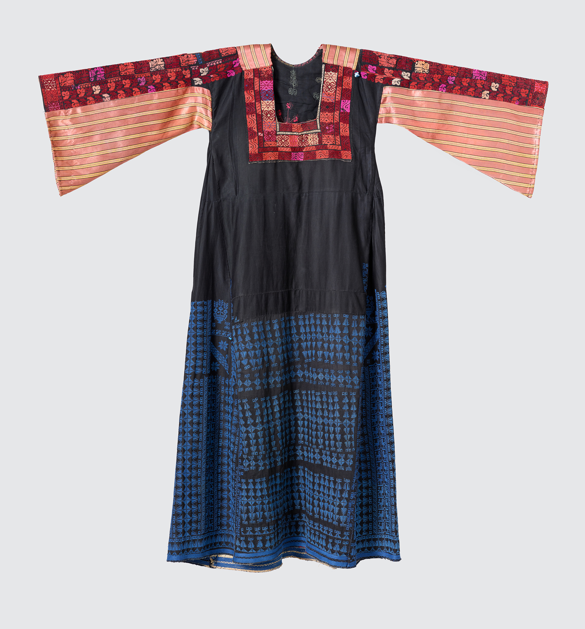 Blue festive dress for an unmarried woman. The dominant color blue stands for sexual inactivity. Collected by Widad Kamel Kawar, 1996, region of origin: Negev-North Sinai (border region with Egypt), ca. 1945.